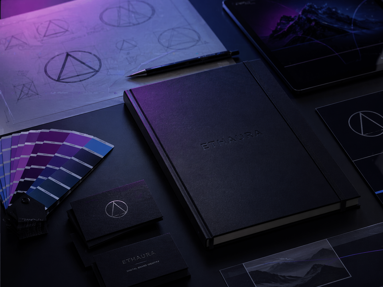Premium branding workspace με βιβλίο ETHAURA, χρωματική παλέτα και brand identity στοιχεία.